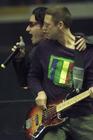 Bono, left, sings next to bass player Adam Clayton during U2's sold out show Monday, April 9 (Darren Makowichuk, Calgary Sun).