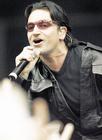 U2's Bono belts out a tune to the sold-out crowd at Calgary's Saddledome (Darren Makowichuk, Calgary Sun)