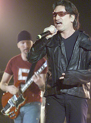 U2's Bono and The Edge start off the Canadian leg of the Elevation tour in Calgary (Darren Makowichuk, Calgary Sun).<br />
