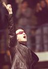 U2 frontman Bono gestures to the crowd during U2's sold-out show April 10 at the Saddledome (Darren Makowichuk, Calgary Sun).
