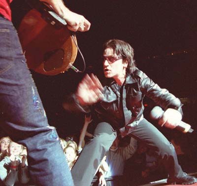 U2 frontman Bono playfully acts like a matador to guitarist The Edge (Darren Makowichuk, Calgary Sun).<br />