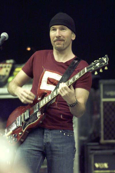 The Edge smiles as he plays his guitar during U2's performance at the Saddledome. The veteran Irish group's two shows in Calgary on April 9 and 10 marked their first appearance in the city (Darren Makowichuk, Calgary Sun).