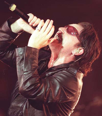 Bono works up a sweat singing at the Saddledome on April 10, the second of two sold-out shows in Calgary and their first ever in the city (Darren Makowichuk, Calgary Sun).