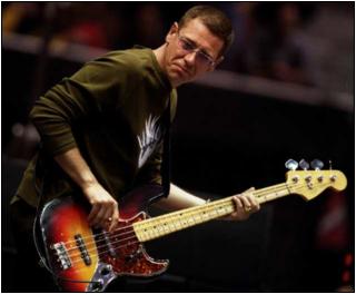  U2's Adam Clayton plays bass at the Elevation tour's stop in Anaheim. (photo FRANCINE ORR / Los Angeles Times)