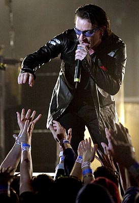 Bono performs onstage during U2's first of two sold-out performances in Toronto Thursday May 24, 2001; Photo: CP PHOTO/Aaron Harris <br />
