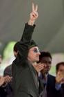 Bono, lead singer of the rock group U2, gestures to the crowd after addressing the 2001 graduating class of Harvard College during class day ceremonies June 6, 2001 in Harvard Yard in Cambridge, Massachusetts. Bono, chosen by the graduates to address them on class day, spoke extensively about his efforts on behalf of debt relief for third world countries. REUTERS/Jim Bourg