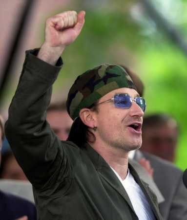 U2's Bono gestures to the students at Class Day ceremonies, where he was guest speaker at Harvard University in Cambridge, Mass., Wednesday, June 6, 2001. (AP Photo/Elise Amendola)