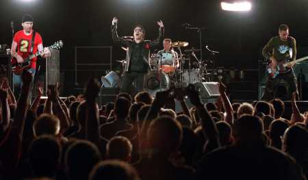 U2 performs at New York's Madison Square Garden Sunday, June 17, 2001. U2 are, from left, The Edge, Bono, Larry Mullen Jr., and Adam Clayton. (AP Photo/Chad Rachman)