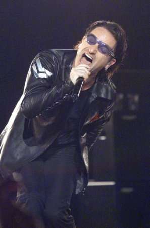 Bono, lead singer for the rock group "U2," performs during a concert in New York's Madison Square Garden, June 17, 2001. The band is nearing the end of it's North American tour and will be starting a European swing in early July. REUTERS/Jeff Christensen REUTERS