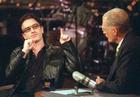 Show host David Letterman listens as U2's Bono, left, talks about his performance at Madison Square Garden during his appearance on CBS's Late Show with David Letterman, Monday, Oct. 29, 2001, in New York. (AP Photo/CBS, John Filo)