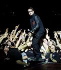 'U2' singer Bono emerges from the crowd during a sold-out stop of the band's Elevation Tour at the Thomas & Mack Center in Las Vegas November 18, 2001. The band is touring to support the album 