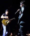 U2's 'The Edge' (L) and 'Bono' perform in Miami during the group's final concert of their 'Elevation Tour,' December 2, 2001. U2 performed 113 concerts in its run through North America. (Colin Braley/Reuters)