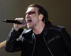 U2 singer Bono sings during the first concert of their Vertigo Tour at the San Diego Sports Arena Monday, March 28, 2005. (AP Photo/Denis Poroy) 