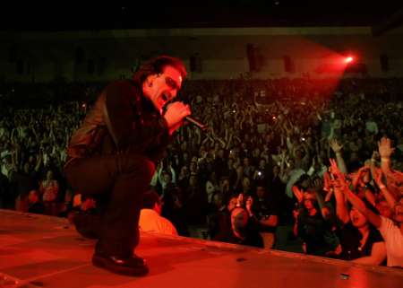 Bono, lead singer of the Irish rock group U2, kicks off the band's world tour "Vertigo" in San Diego, California March 28, 2005. The Irish rock band has sold over 2.2 million tickets and grossed some US$185 million with advance ticket sales. By the time U2's Vertigo concludes, it will be one of the top-grossing rock tours of all time, with a total nearing $300 million . REUTERS/Mike Blake
