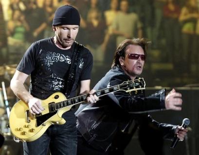 U2 guitarist The Edge, left, and lead singer Bono perform during during the first concert of their Vertigo Tour at the San Diego Sports Arena Monday, March 28, 2005. (AP Photo/Denis Poroy)