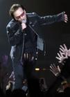 Fans reach out as U2 lead singer Bono performs during the first concert of their Vertigo Tour at the San Diego Sports Arena Monday, March 28, 2005. (AP Photo/Denis Poroy) 