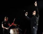 Bono, right, and Larry Mullen Jr. of U2 perform in Los Angeles, Tuesday, April 5, 2005. (AP Photo/Chris Pizzello)