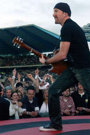The Edge, guitarist of Irish rock band U2, performs during a concert of the group at the King Baudouin Stadium in Brussels June 10, 2005. U2 is currently on their 'Vertigo 2005' world tour with Brussels as the first concert in Europe. REUTERS/Str