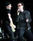 Bono, singer of Irish rockband U2, and guitarist The Edge, left, perform in front of 60,000 fans at the Arena AufSchalke in Gelsenkirchen, Germany, Sunday, June 12, 2005. The concert is their first in Germany and the second in Europe of U2's Vertigo tour. (AP Photo/Martin Meissner)
