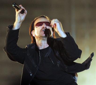 Bono, singer of Irish rock band U2, performs in front of 60,000 fans at the Arena AufSchalke in Gelsenkirchen, western Germany, Sunday, June 12, 2005. The concert is their first in Germany and the second in Europe of U2's Vertigo tour. (AP Photo/Martin Meissner)