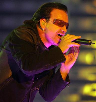Bono, singer of Irish rock band U2 performs in front of 60,000 fans at the Arena AufSchalke in Gelsenkirchen, Germany, Sunday, June 12, 2005. The concert is the first in Germany and the second concert in Europe of U2's Vertigo tour. (AP Photo/Martin Meissner)