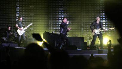 Irish rock band U2 performs in front of 60,000 fans at the Arena AufSchalke in Gelsenkirchen, western Germany, Sunday, June 12, 2005. The concert is the first in Germany and the second concert in Europe of U2's Vertigo tour. (AP Photo/Martin Meissner)