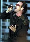 Singer Bono of Irish rock group U2 performs on stage during their Vertigo 2005 Tour in Zurich, Switzerland, Monday, July, 18, 2005. (AP Photo/Keystone, Walter Bieri)