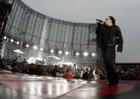 Irish band U2 vocalist Bono performs during the band's concert in Switzerland at the Letzigrund stadium in Zurich, July 18, 2005. REUTERS/Siggi Bucher