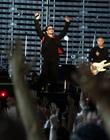 Singer Bono of Irish rock group U2 performs on the stage during their Vertigo 2005 Tour at the San Siro stadium in Milan, Italy, Wednesday, July, 20, 2005. (AP Photo/Luca Bruno)