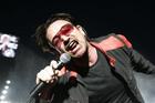 Singer Bono of the Irish rock group U2 performs on the stage during their Vertigo 2005 Tour at Rome's Olympis stadium, Italy, Saturday, July 23, 2005. (AP Photo/Pier Paolo Cito)