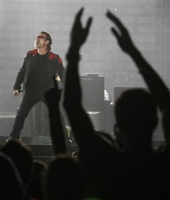 Singer Bono of the Irish rock group U2 performs on the stage during their Vertigo 2005 Tour at Rome's Olympis stadium, Italy, Saturday, July 23, 2005. (AP Photo/Pier Paolo Cito)