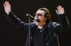 U2's Bono performs during the band's concert in Toronto, Monday Sept. 12, 2005. (AP Photo/Aaron Harris, CP)