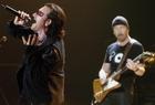 U2's Bono, left, and The Edge perform during the band's concert in Toronto, Monday Sept. 12, 2005. (AP Photo/Aaron Harris, CP)