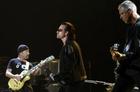 U2's Bono, centre, The Edge, left, and Adam Clayton perform during the band's concert in Toronto, Monday Sept. 12, 2005. (AP PHOTO/CP, Aaron Harris)