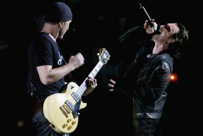 U2's Bono, right, and The Edge perform during the band's concert in Toronto, Monday Sept. 12, 2005. (AP Photo/Aaron Harris, CP)