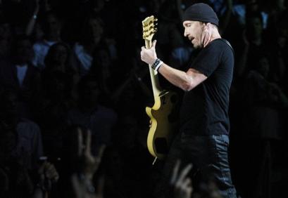 U2's The Edge performs during the band's concert in Toronto, Monday Sept. 12, 2005. (AP PHOTO/CP, Aaron Harris)