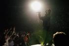 U2's Bono performs during the band's concert in Toronto, Monday, Sept. 12, 2005. (AP PHOTO/CP, Aaron Harris)