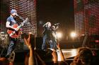 U2's lead singer Bono, center and guitarist The Edge perform during the Vertigo Tour at Madison Square Garden in New York, Monday, Nov. 21, 2005. (AP Photo/Jeff Christensen)