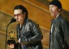 U2 members Bono (L) and The Edge accept the Grammy Award for Best Performance by a Duo or Group at the 44th Annual Grammy Awards in Los Angeles February 27, 2002. U2 won for their song 