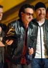 U2's Bono, center, accepts the group's award for best pop performance at the 44th annual Grammy Awards, Wednesday, Feb. 27, 2002, in Los Angeles. (AP Photo/Kevork Djansezian)