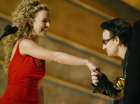 Bono (R) from U2 kisses the hand of presenter Britney Spears as he accepts the Grammy Award for Best Pop Performance by a Duo or Group at the 44th Annual Grammy Awards in Los Angeles February 27, 2002. U2 won for their song 