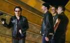 U2 members Bono (L), The Edge (C), Adam Clayton and Larry Mullen (R) accept the Grammy Award for Best Performance by a Duo or Group at the 44th Annual Grammy Awards in Los Angeles February 27, 2002. U2 won for their song 