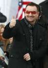 Bono of U2 gestures to the crowd during the We Are One: Inaugural Celebration at the Lincoln Memorial in Washington January 18, 2009. REUTERS/Jason Reed (UNITED STATES)