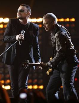 Bono, left, and Adam Clayton from Irish band U2 perform at the Brit Awards 2009 at Earls Court exhibition centre in London, England, Wednesday, Feb. 18, 2009. (AP Photo/MJ Kim)