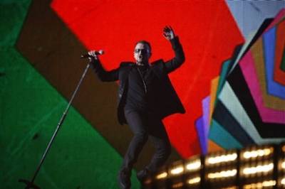 Bono from Irish band U2 performs at the Brit Awards 2009 at Earls Court exhibition centre in London, England, Wednesday, Feb. 18, 2009. (AP Photo/MJ Kim)