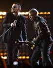Bono, left, and Adam Clayton from Irish band U2 perform at the Brit Awards 2009 at Earls Court exhibition centre in London, England, Wednesday, Feb. 18, 2009. (AP Photo/MJ Kim)